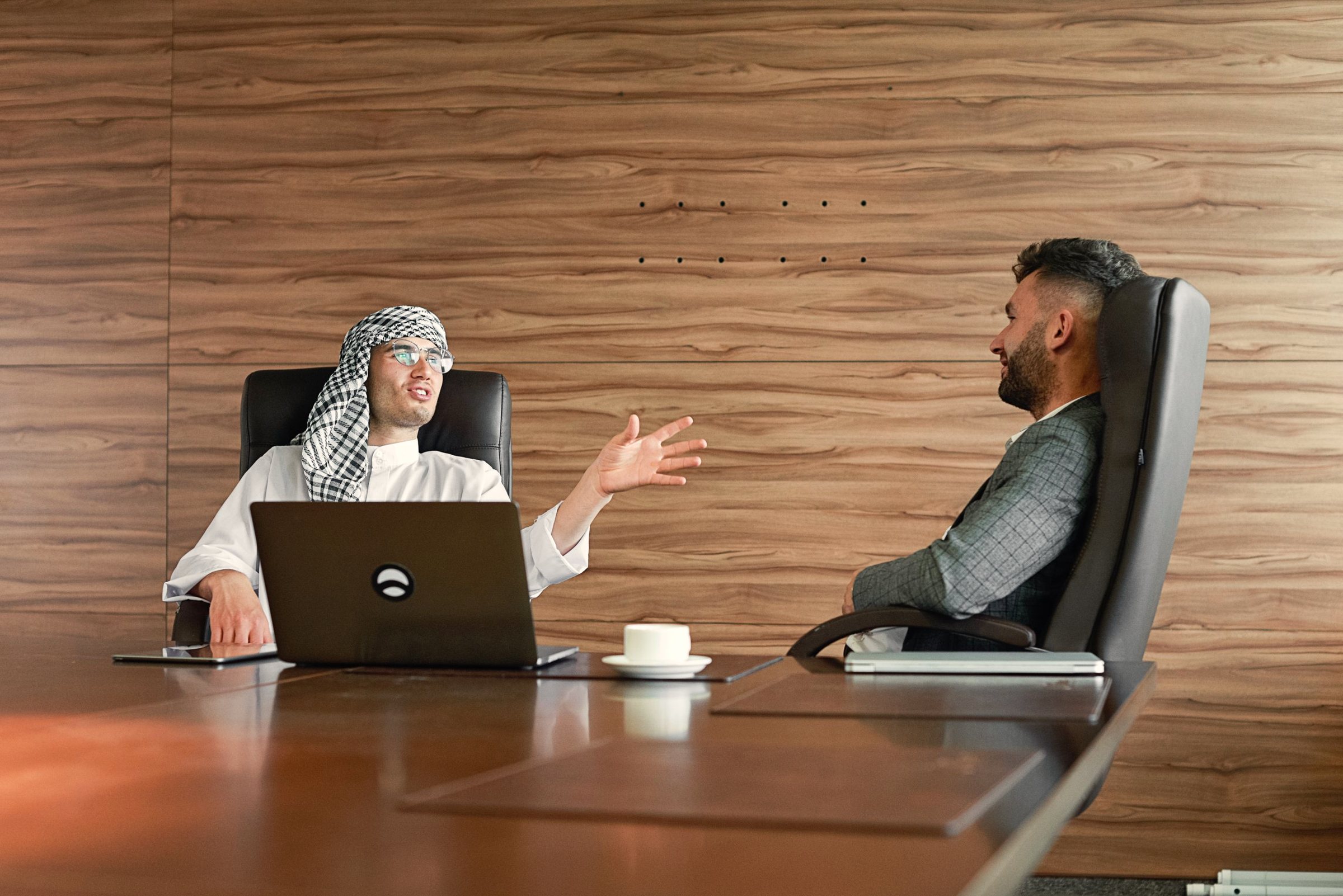 Two advisors reviewing a company file together